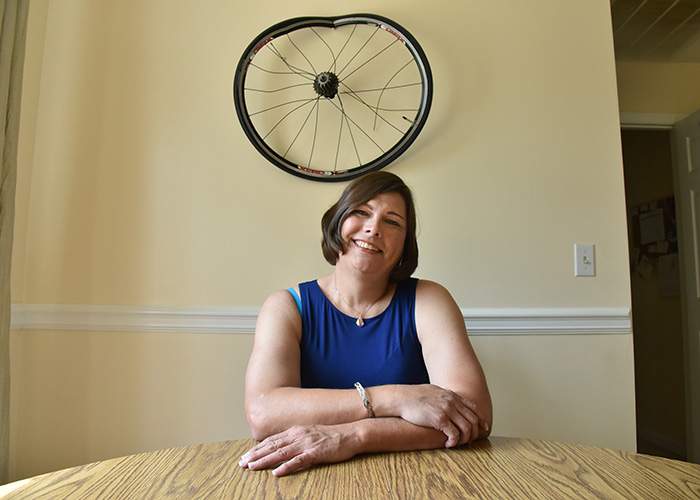 The damaged bike wheel from her accident hangs on the wall in her home, a reminder of a major turning point in her life when she decided to accept herself as transgender and begin transitioning.