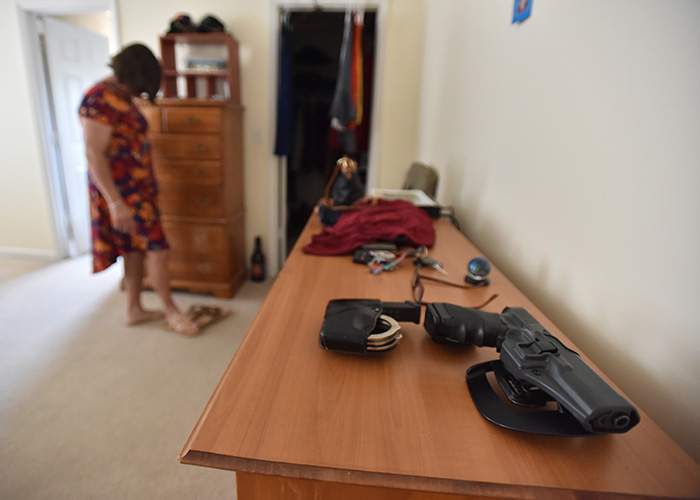 The tools of Anna’s trade, a service revolver and handcuffs, are never far from reach in Anna’s home in Perry.