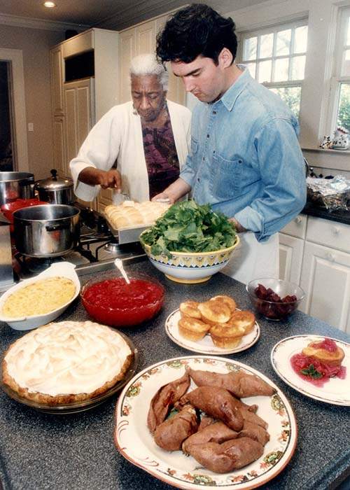 Lewis and Scott Peacock, formerly the chef of Watershed, prepare a traditional Southern meal together in 1992. AJC file