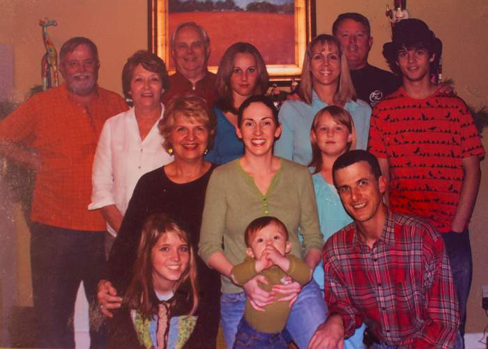 A Mackinnon family photo captures the first time Pete (bottom right), one of the sons Leslie gave up for adoption, joined the family for Christmas. Contributed photo.