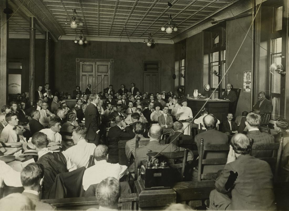 Inside the courtroom: Leo Frank (seated center right) listens as National Pencil Company worker Jim Conley (seated far right) testifies in the Phagan murder trial, 1913. Future Georgia governor Hugh Dorsey (standing left center), acting as prosecutor, questions Conley. Conley had also been under suspicion as having a role in Mary Phagan's death.PHOTO: AJC Photo Archives