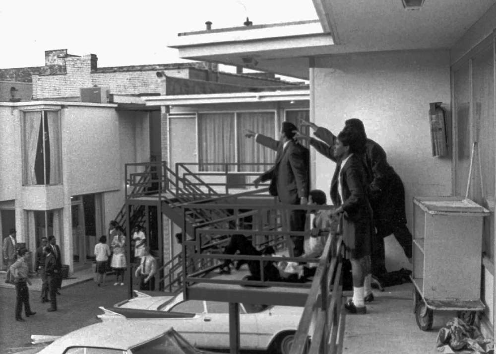 This 1968 photo was taken minutes after an assassin's bullet struck Dr. Martin Luther King Jr. at the Lorraine Motel in Memphis, Tenn., on April 4, 1968. According to the photographer, Joseph Louw, the men at right, several of Dr. King's aides, stand over King's body as they point out to police where they heard the shot. In the center of the photo is Andrew Young. AP Photo\/Files, Copyright 1968 Time Inc.