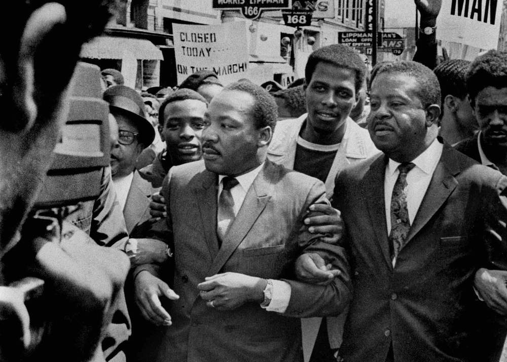 In this March 28, 1968, file photo, Martin Luther King Jr. and Ralph Abernathy, right, lead a march on behalf of striking Memphis, Tenn., sanitation workers. Sam Melhorn\/The Commercial Appeal via AP