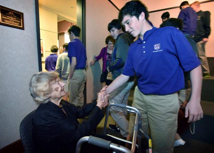 Students from Darlington School in Rome greet Eva after she speaks to them about her experiences during the Holocaust. 